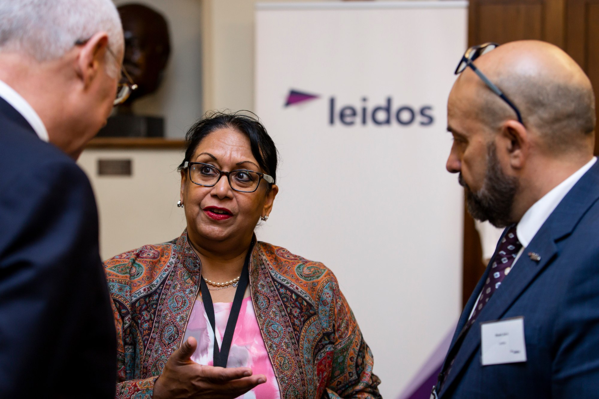 Baroness Verma pictured with Leidos UK and Europe's Simon Fovargue and Stuart John | Credit: Visual Eye